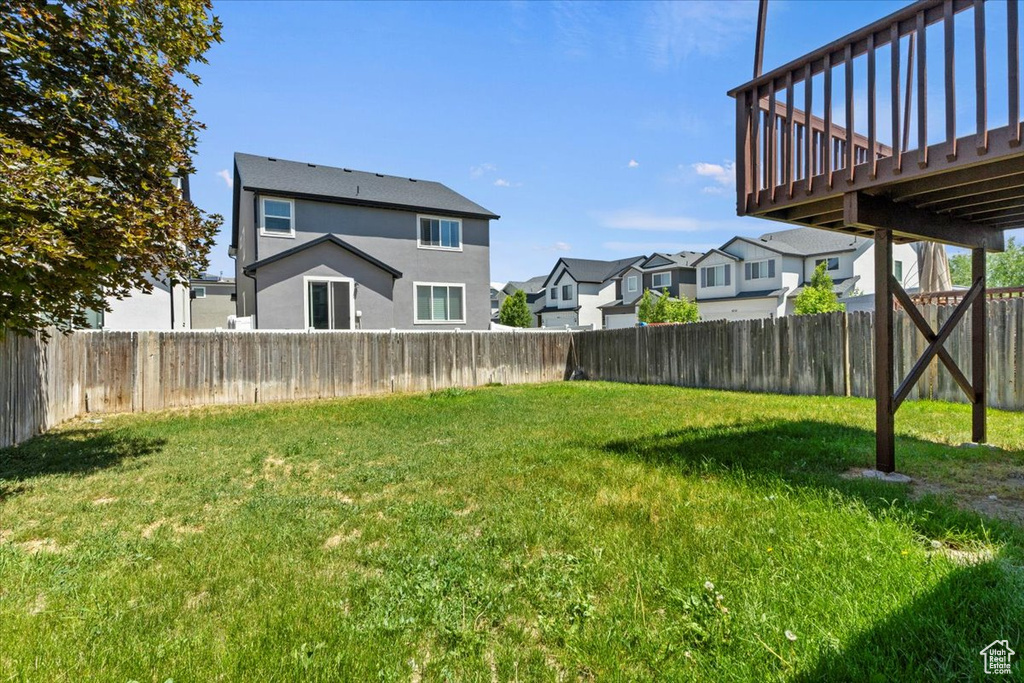 View of yard featuring a residential view and a deck