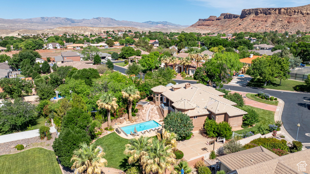 Aerial perspective of suburban area with a mountainous background