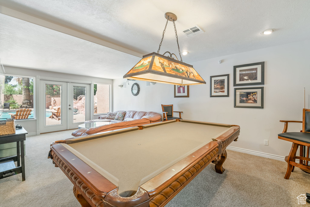 Playroom featuring carpet flooring, pool table, and french doors