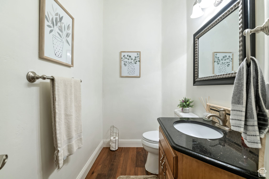 Bathroom with wood finished floors and vanity