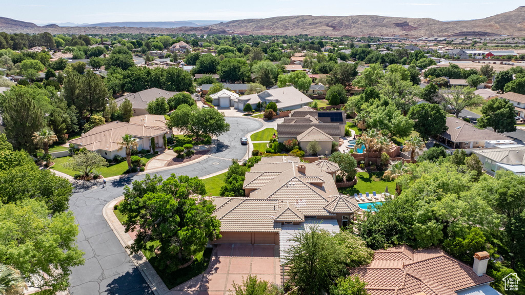 Aerial view of residential area featuring a mountain backdrop