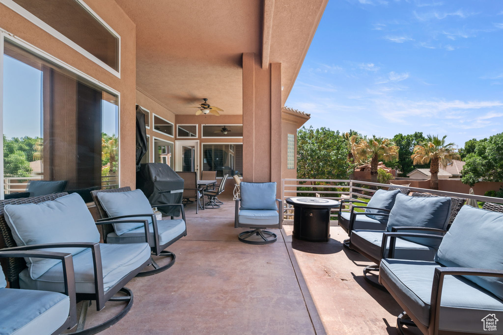 Patio / terrace with a ceiling fan and a grill