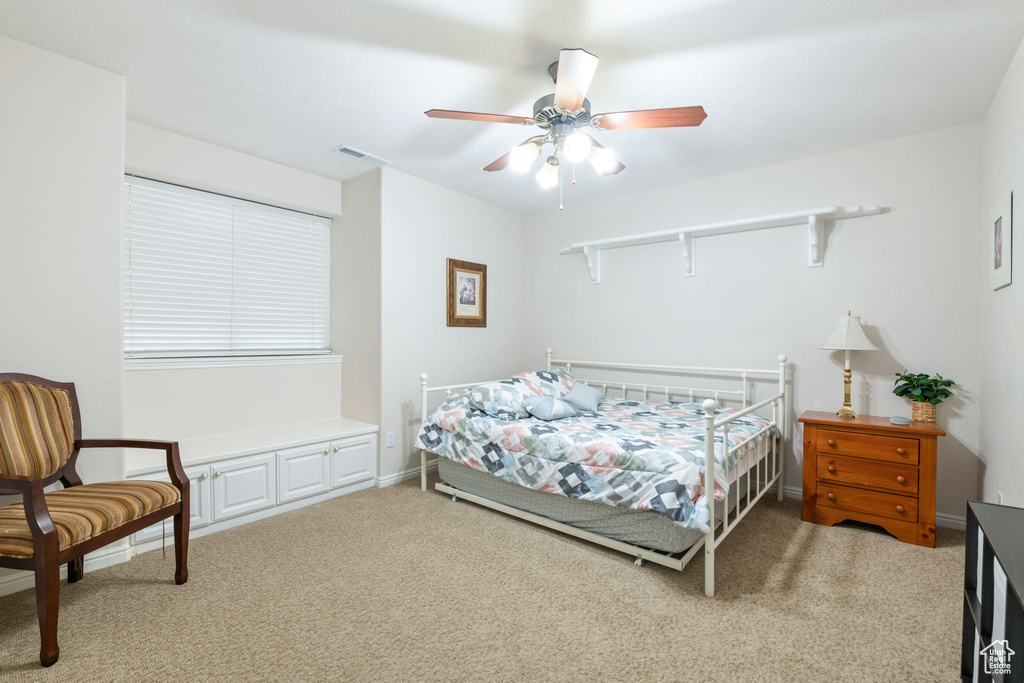 Bedroom with carpet floors and a ceiling fan