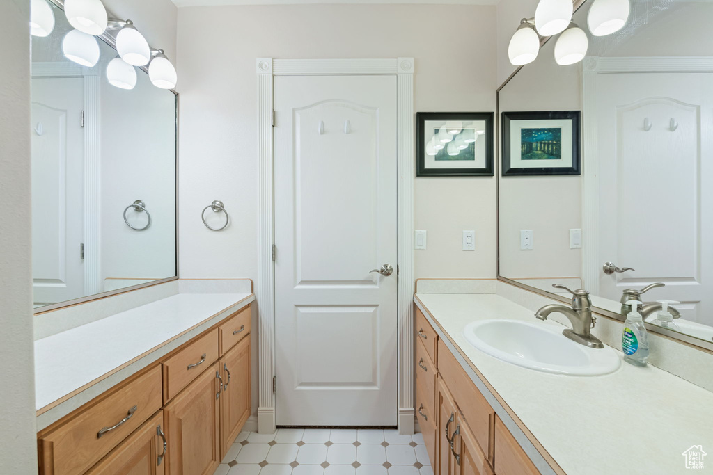 Bathroom with vanity and tile patterned floors