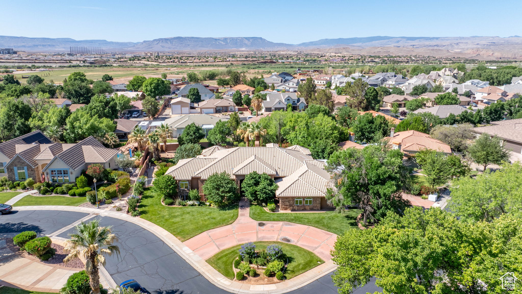 Aerial perspective of suburban area with a mountainous background