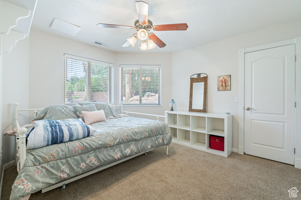 Bedroom featuring carpet floors and ceiling fan