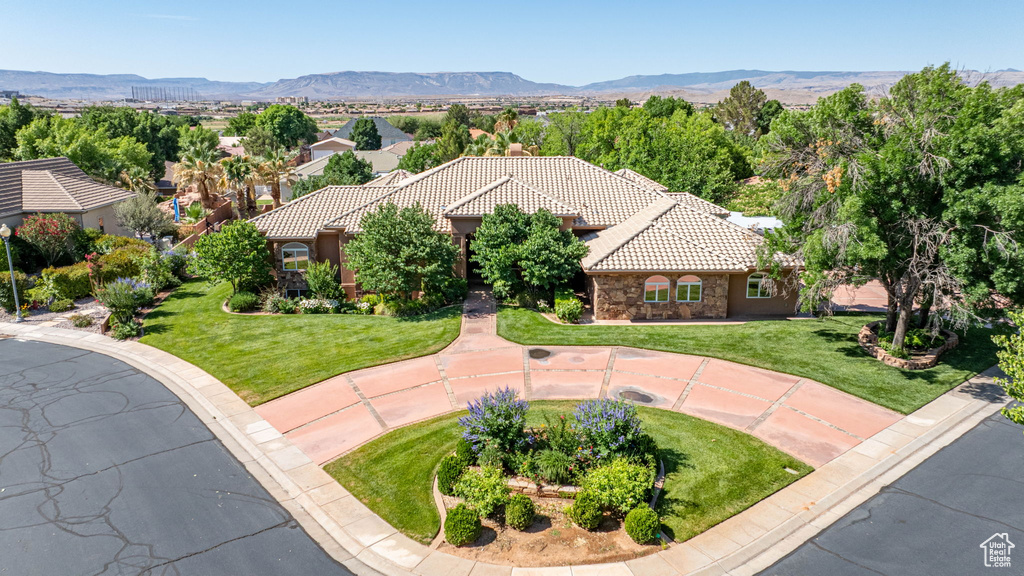 View from above of property with a mountain backdrop