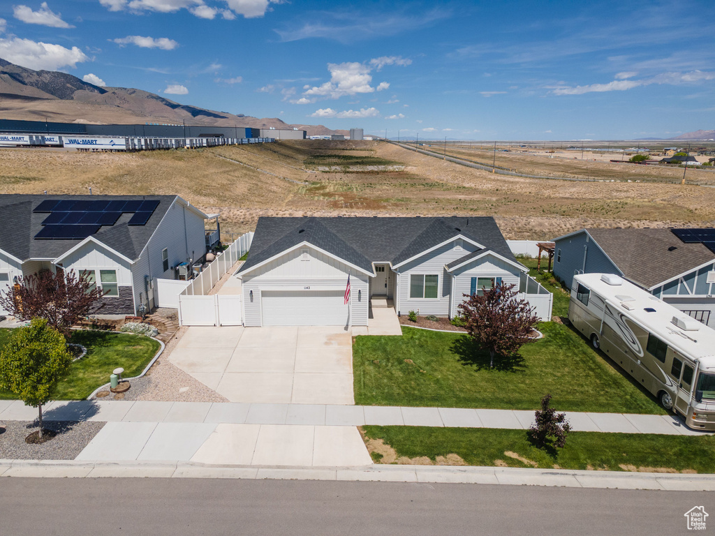 Aerial view of property and surrounding area with mountains