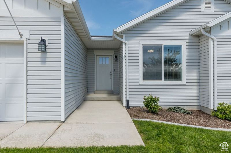 Entrance to property featuring a garage