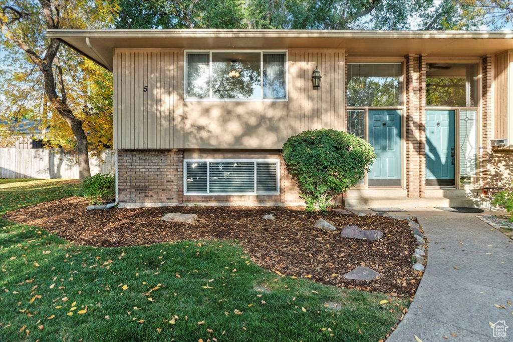 View of front of house featuring brick siding