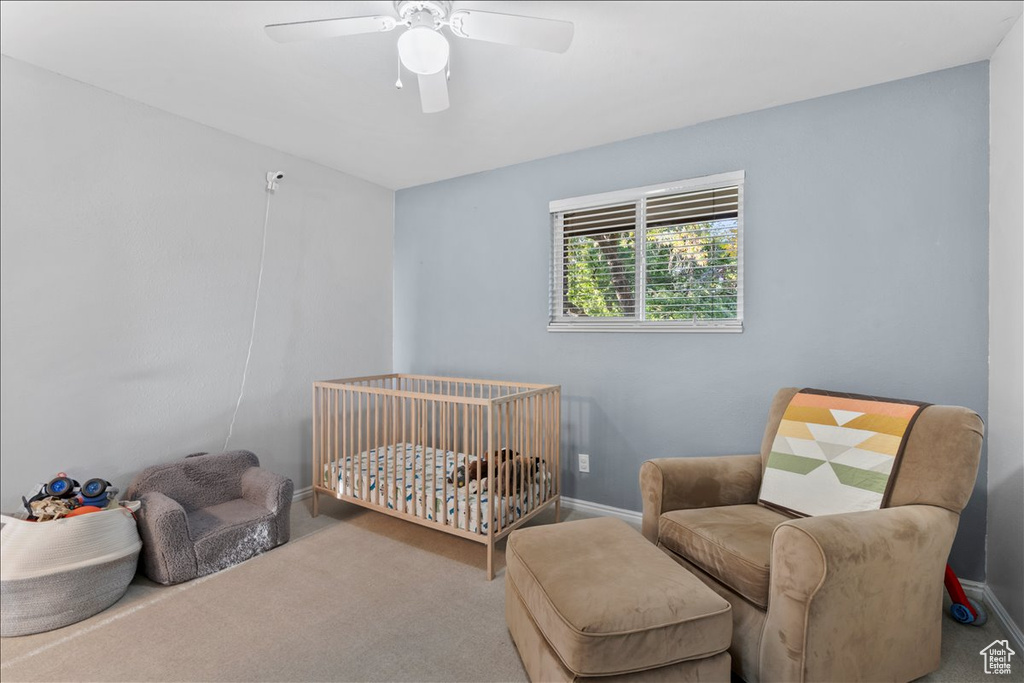 Bedroom with carpet flooring, baseboards, and ceiling fan