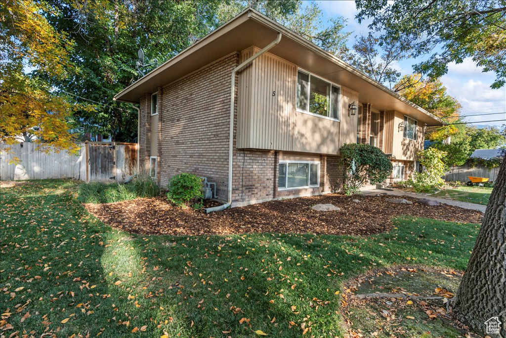 View of property exterior featuring brick siding