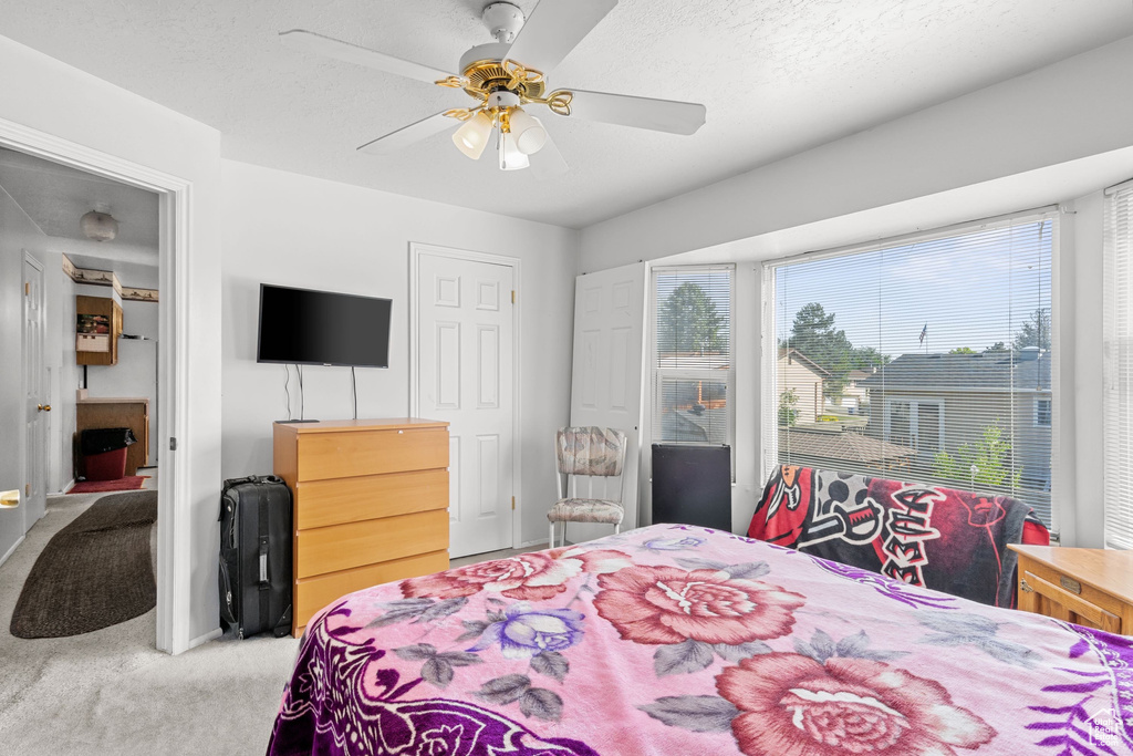 Bedroom with carpet and ceiling fan