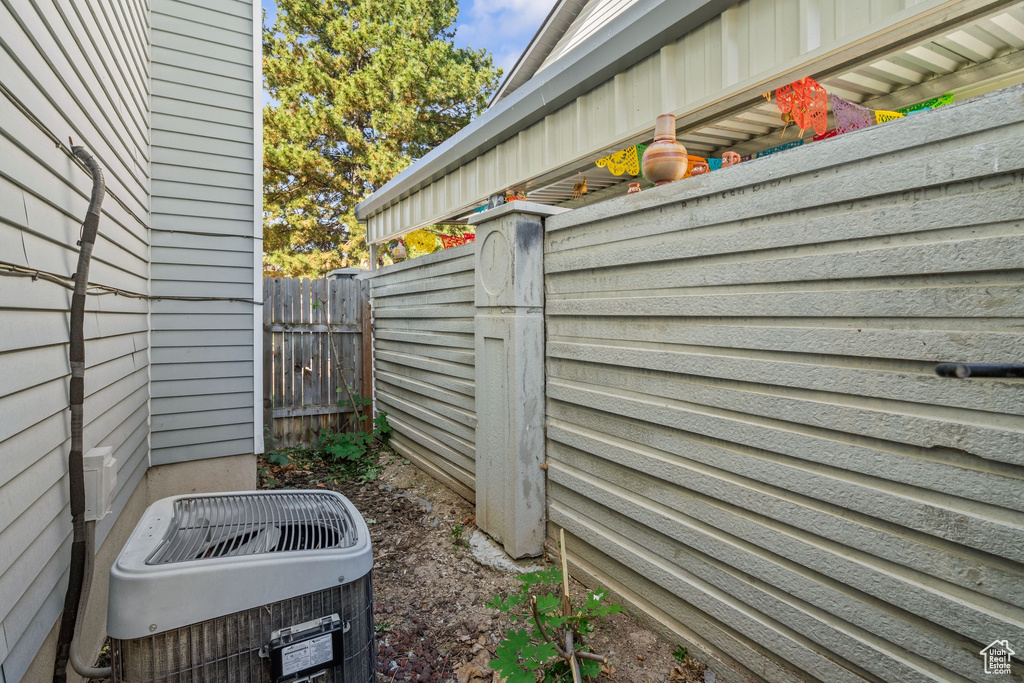 View of property exterior featuring central AC unit