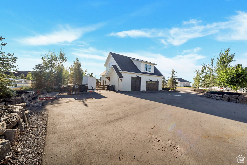 Back of house with a garage