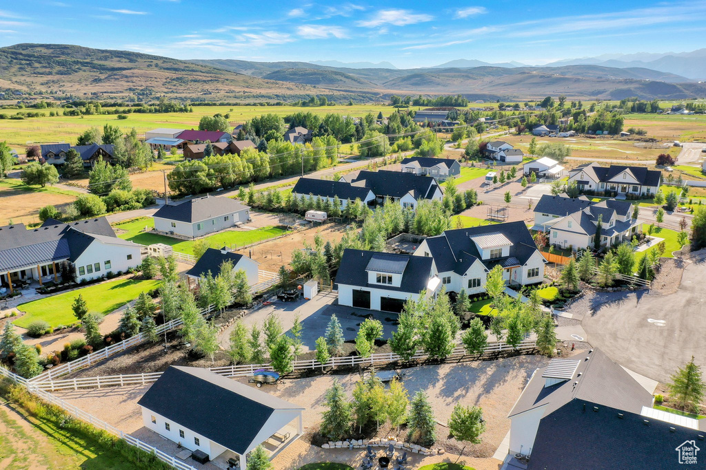 Aerial perspective of suburban area featuring a mountainous background