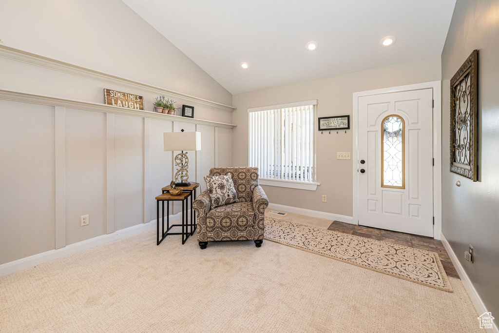 Entryway with carpet flooring, recessed lighting, lofted ceiling, and baseboards