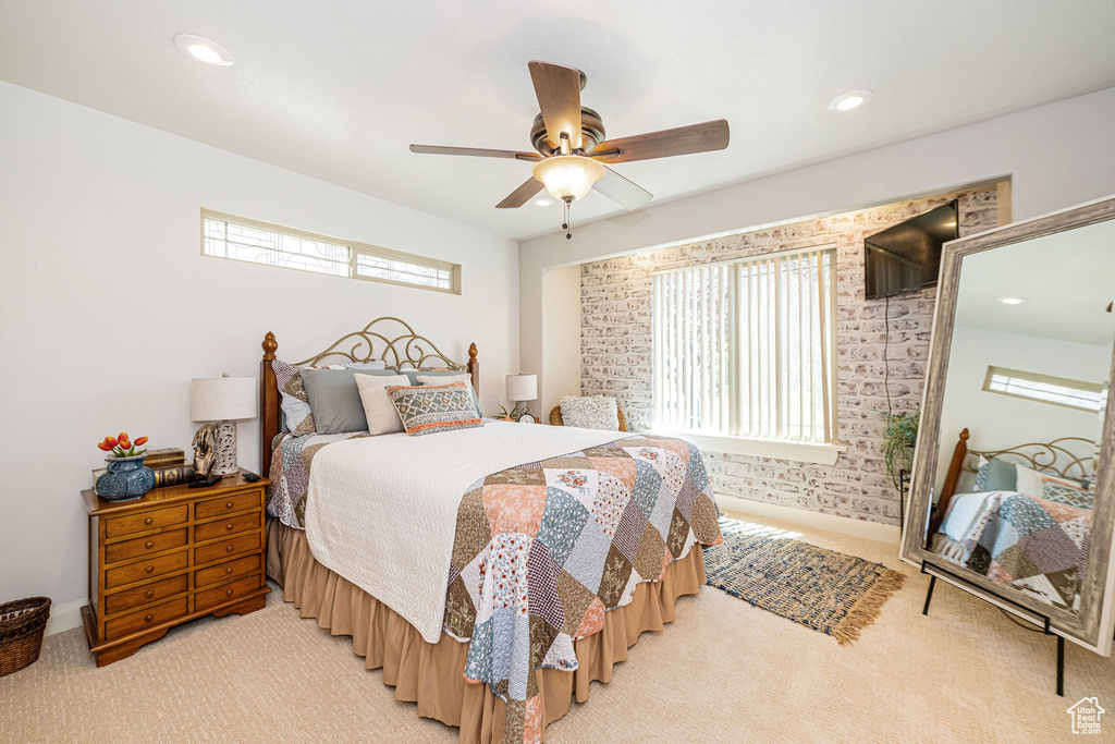 Bedroom with light colored carpet, a ceiling fan, and recessed lighting