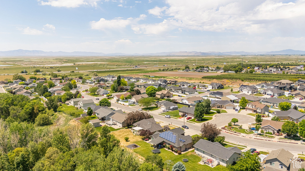 Aerial perspective of suburban area featuring a mountain backdrop