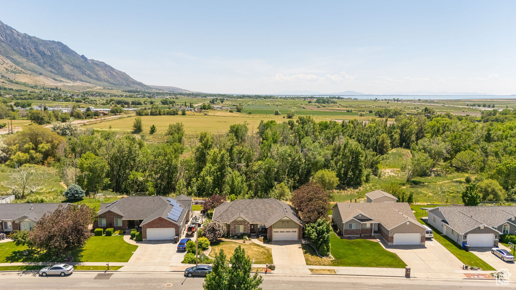 Aerial perspective of suburban area featuring a mountain backdrop