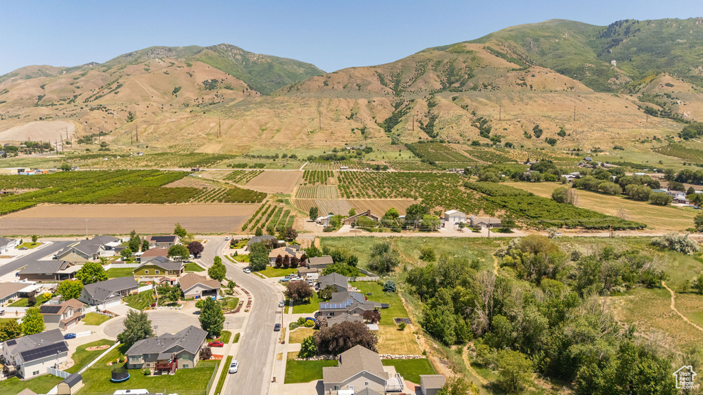 Aerial view of property's location with mountains, abundant farmland, and rural landscape