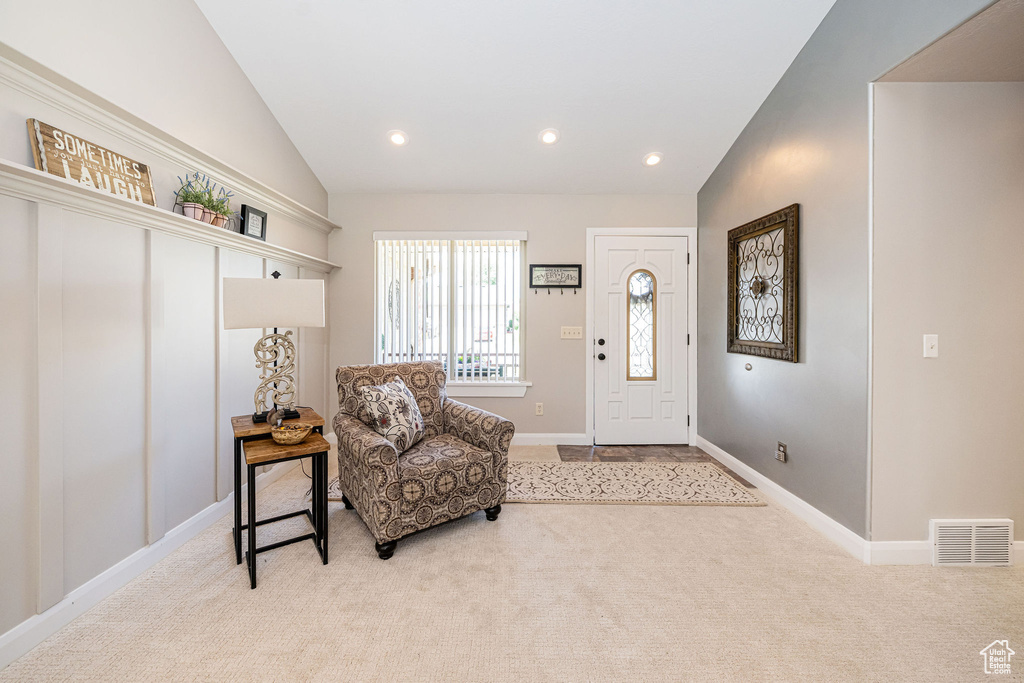 Entryway with vaulted ceiling, carpet flooring, baseboards, and recessed lighting