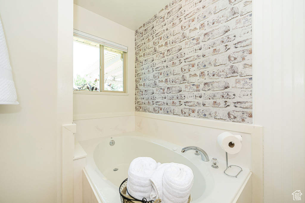 Full bathroom featuring a bath