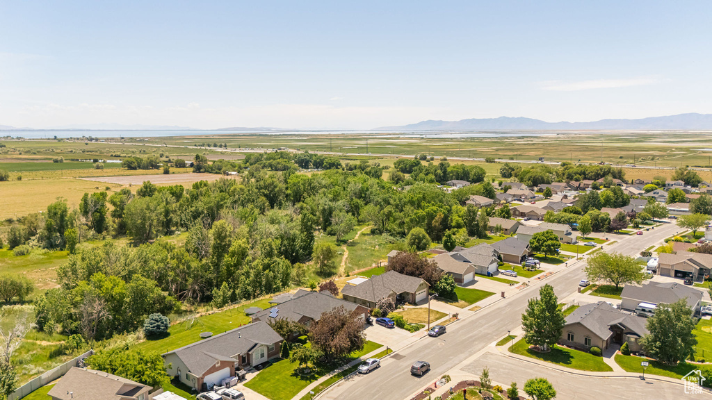 Aerial perspective of suburban area featuring a mountain backdrop