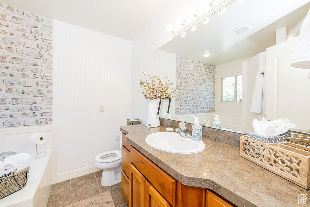 Full bath with vanity, a bathtub, and toilet