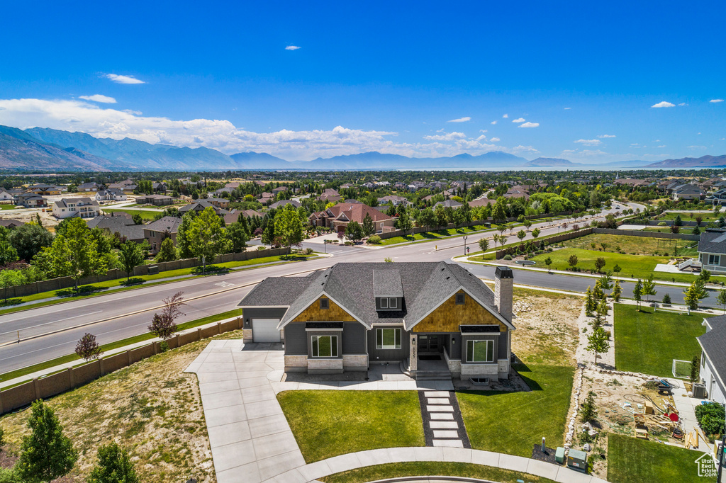 Aerial view of residential area featuring mountains