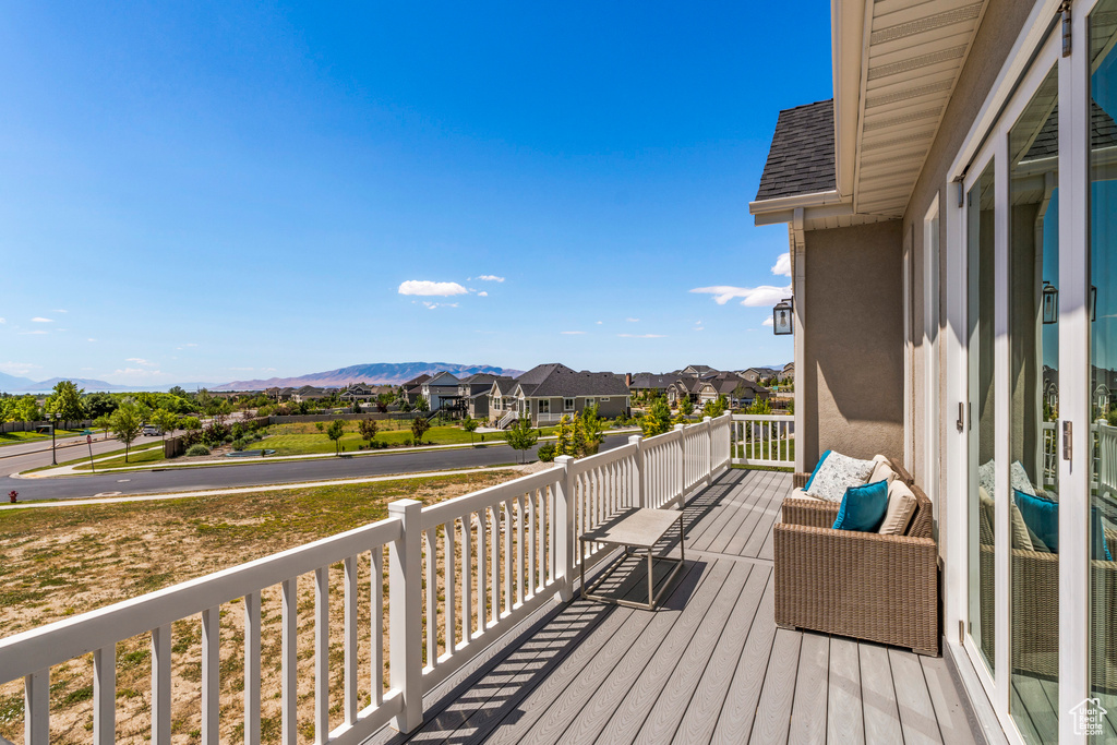 Porch featuring a residential view and a mountain view