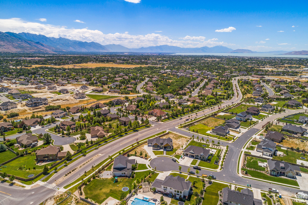 View of property location with a mountain backdrop and nearby suburban area