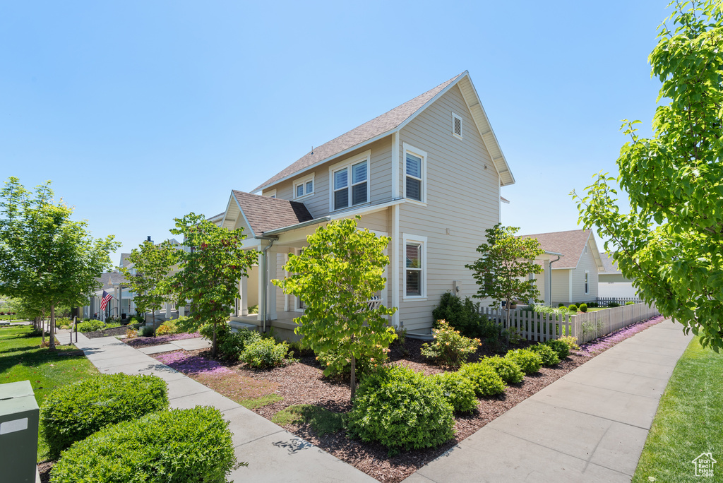 View of home\\\'s exterior featuring a shingled roof