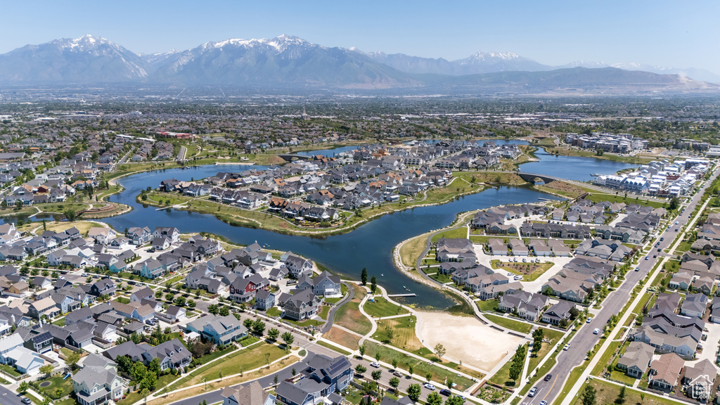 Aerial view of property\\\'s location featuring nearby suburban area and a water and mountain view