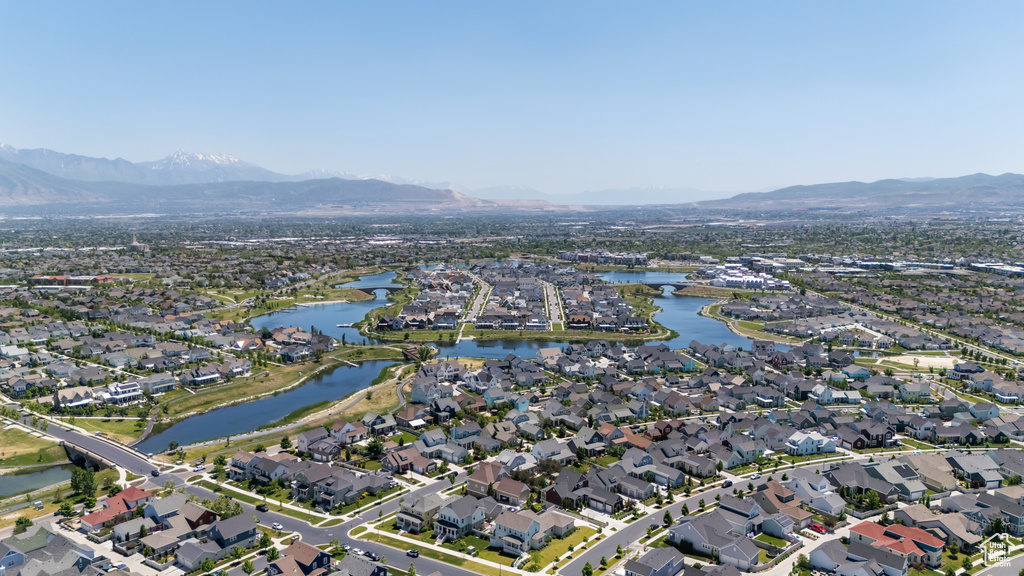 View of property location with nearby suburban area and a water and mountain view