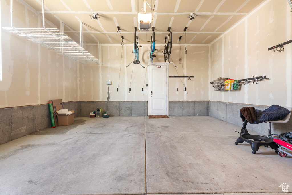 Garage featuring a garage door opener
