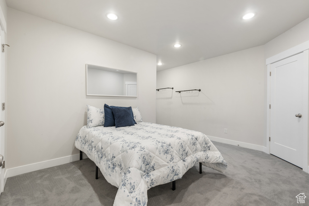 Bedroom featuring carpet flooring, recessed lighting, and baseboards