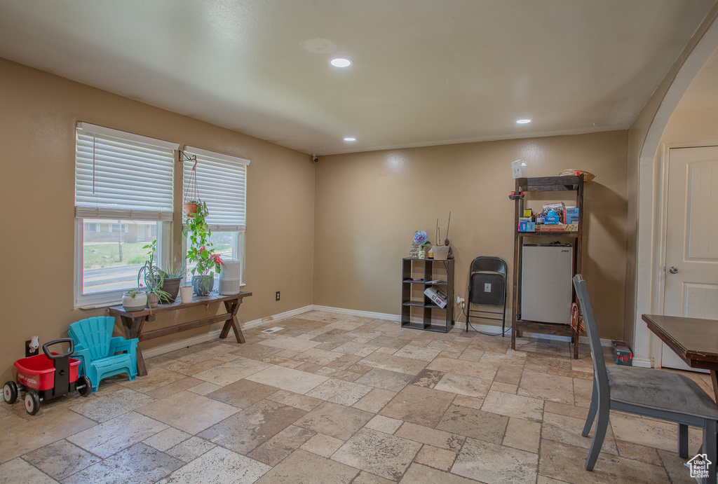 Office area with stone tile flooring, recessed lighting, and baseboards