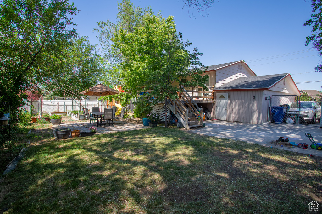 View of yard featuring a patio area, a deck, and stairway