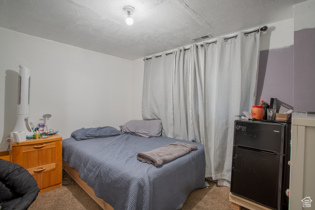 Bedroom featuring carpet flooring