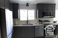 Kitchen featuring stainless steel microwave