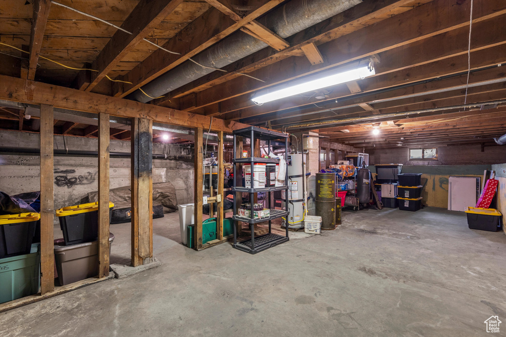 Below grade area featuring water heater