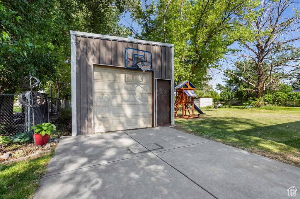 Detached garage with concrete driveway