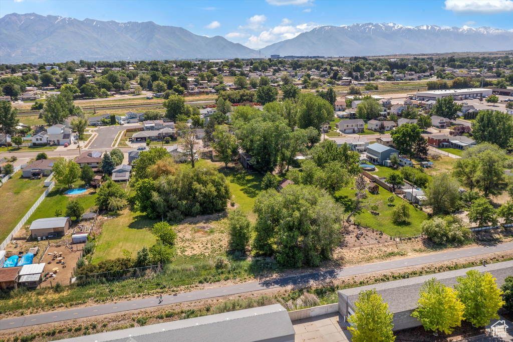 Aerial view of residential area featuring a mountainous background