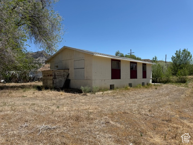 View of home's exterior with crawl space