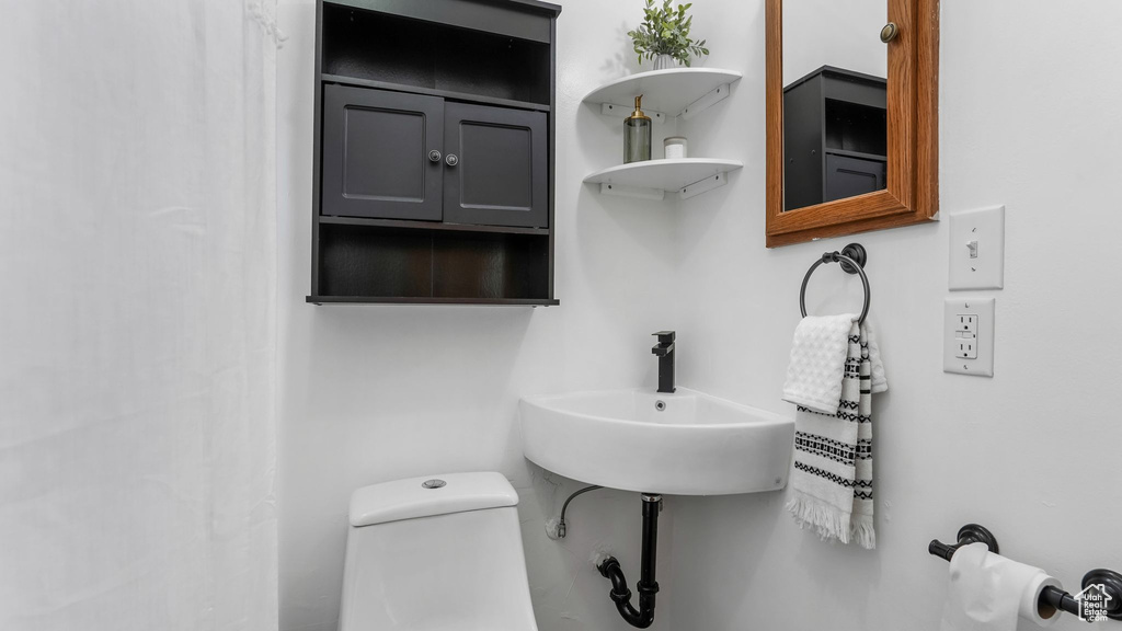 Bathroom with toilet and a sink