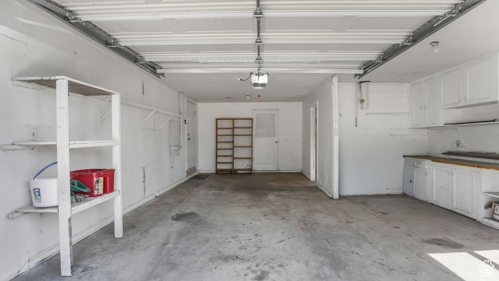 Garage featuring a garage door opener