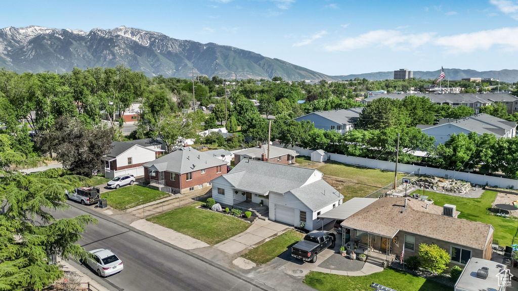 Aerial perspective of suburban area featuring a mountainous background
