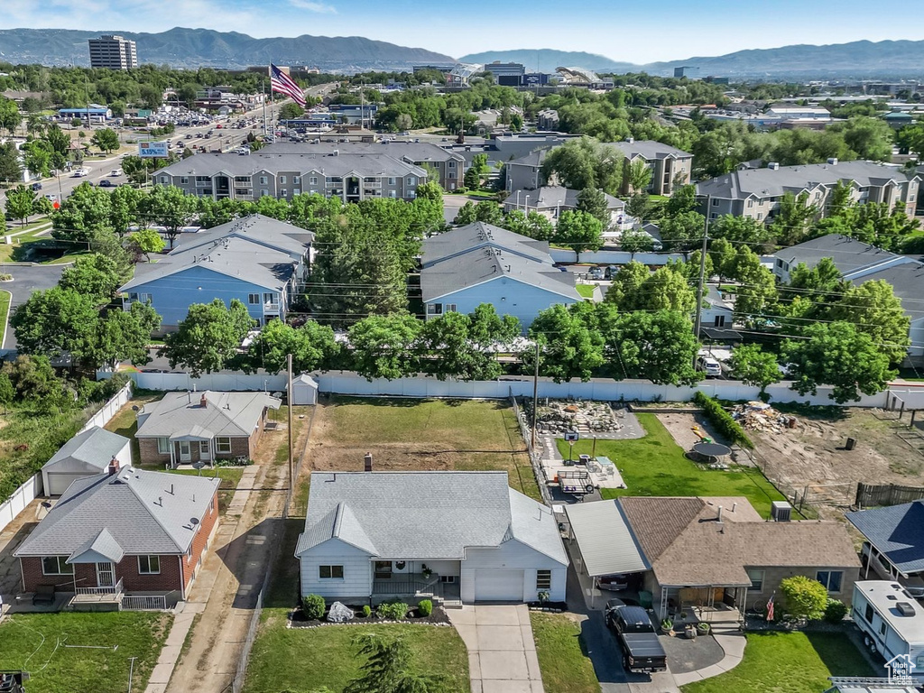 Aerial perspective of suburban area featuring a mountainous background