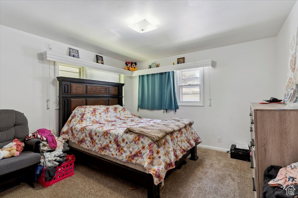 Carpeted bedroom with baseboards